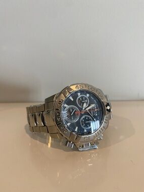 Invicta Stainless Steel Chronograph Watch with Black Dial and Orange Details
